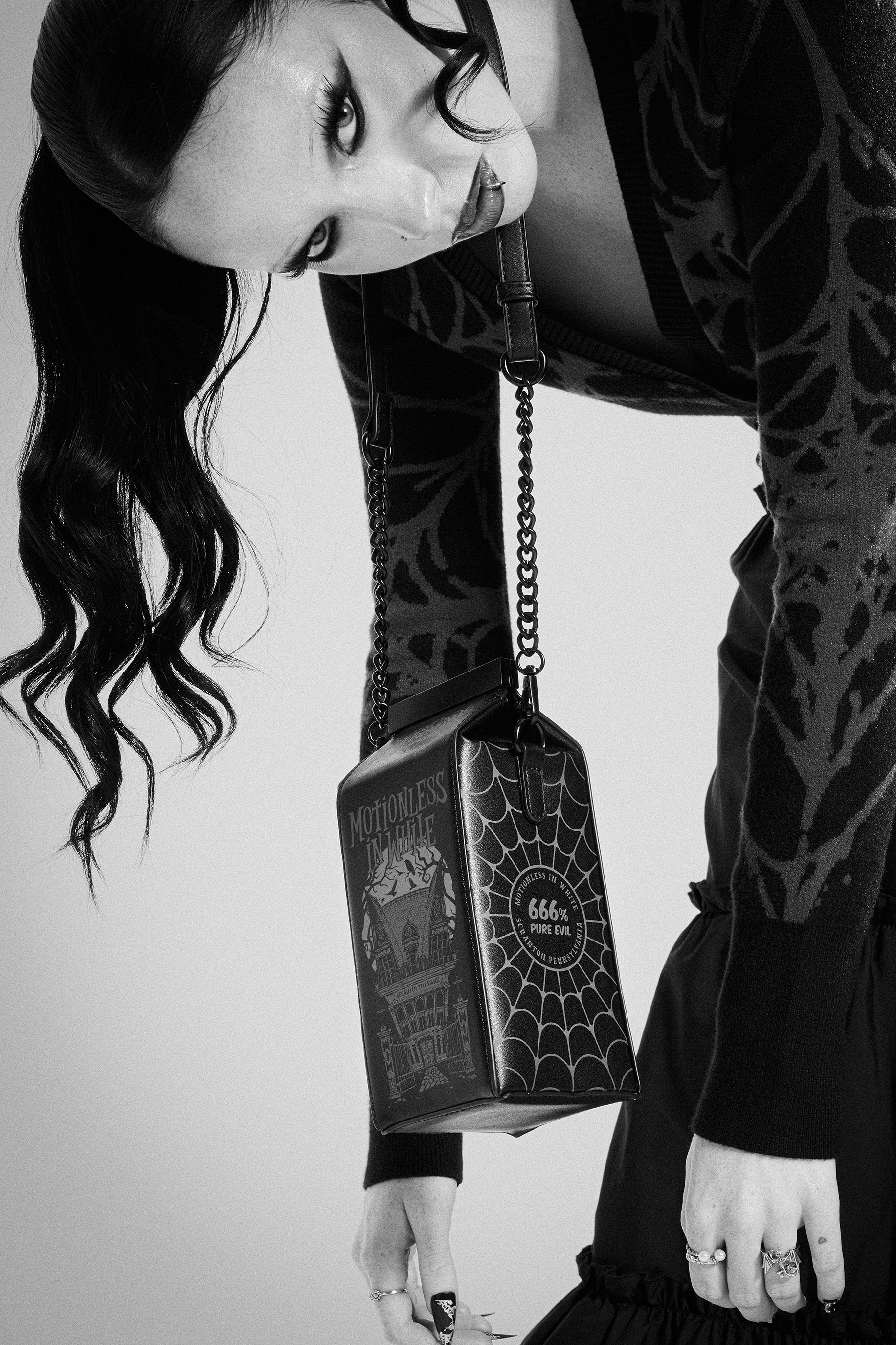 MOTIONLESS MILK HANDBAG